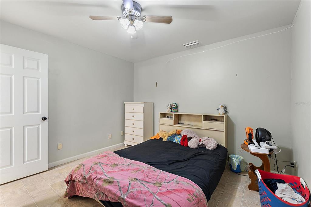 19550 Jody Morgan Road Perry, FL 32348 - Photo 68 of 79 a bedroom with a bed and closet