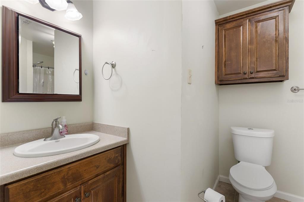 19550 Jody Morgan Road Perry, FL 32348 - Photo 73 of 79 a bathroom with a toilet sink and mirror