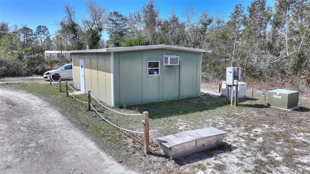 19550 Jody Morgan Road Perry, FL 32348 - Photo 9 of 79 a view of a barn in the middle of a yard