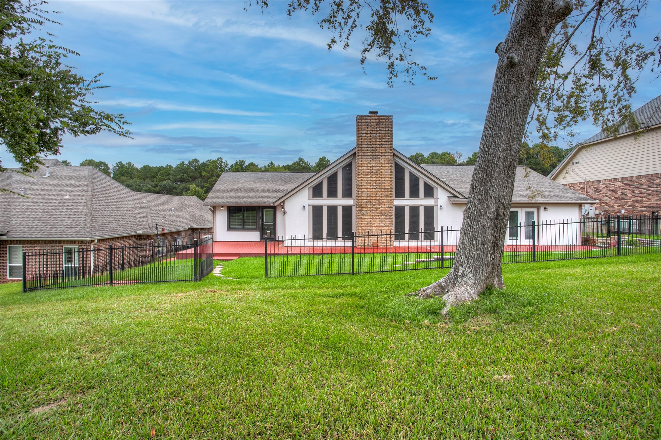 479 Cherry Hills Drive Huntsville, TX 77340 - Photo 12 of 49 a view of a house with backyard and garden