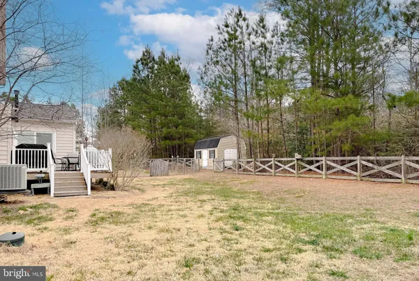 a view of a backyard with swimming pool