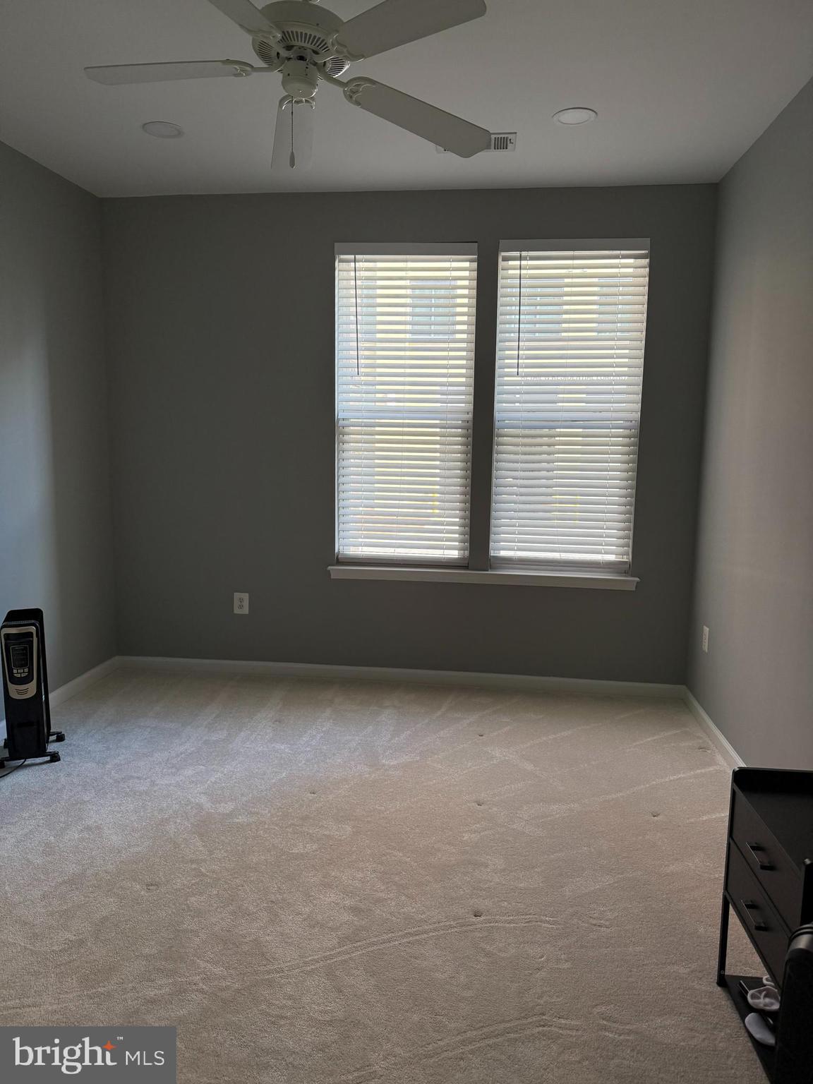 12001 Market Street, Unit 171 Reston, VA 20190 - Photo 6 of 10 an empty room with a window