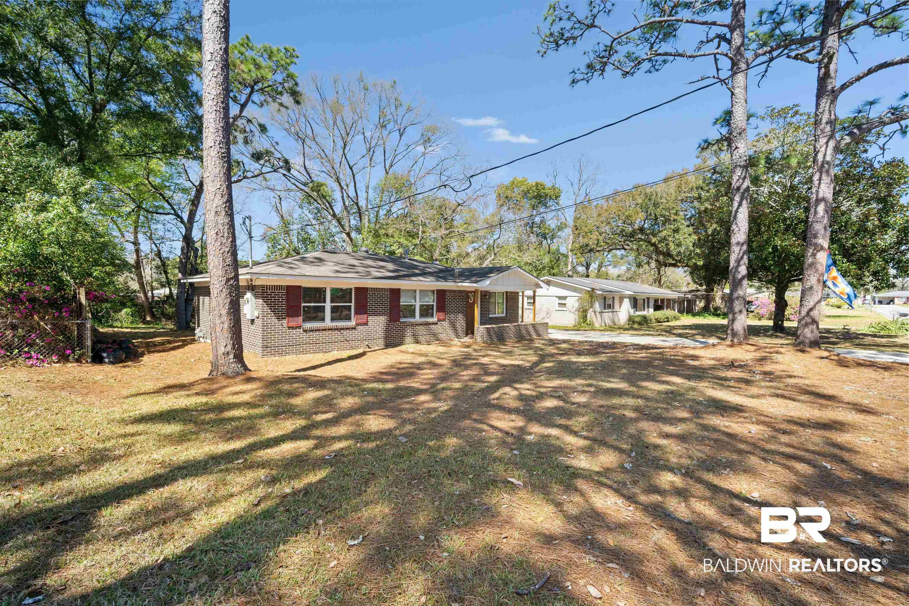 672 Tarawa Drive Mobile, AL 36609 - Photo 3 of 26 Ranch-style home with brick siding and a front lawn