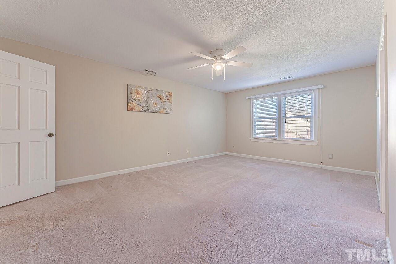 2616 Sawmill Road Raleigh, NC 27613 - Photo 11 of 18 a view of an empty room with a window