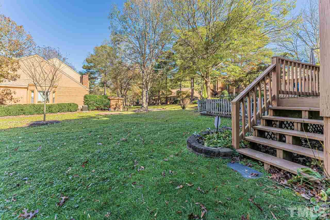 2616 Sawmill Road Raleigh, NC 27613 - Photo 17 of 18 a view of a house with a yard