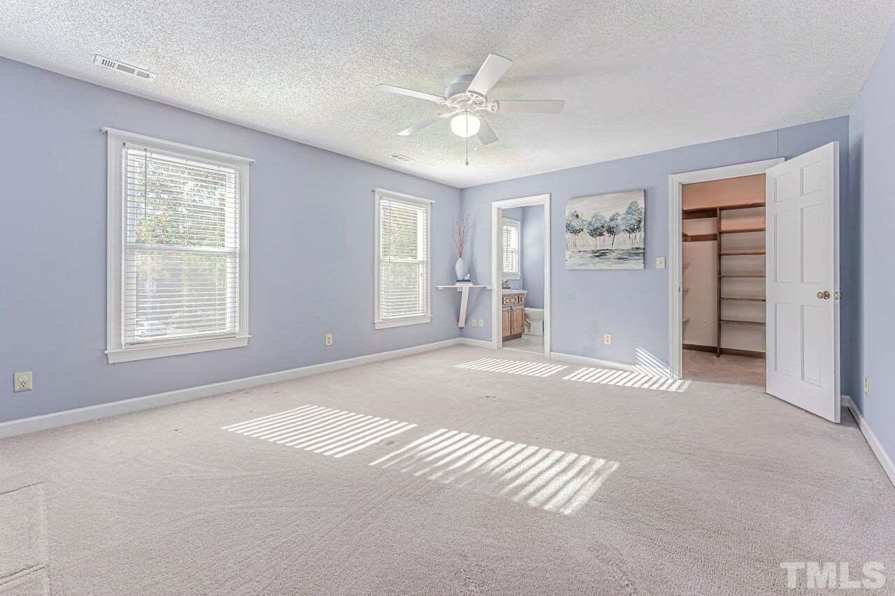 2616 Sawmill Road Raleigh, NC 27613 - Photo 8 of 18 a view of an empty room with a window