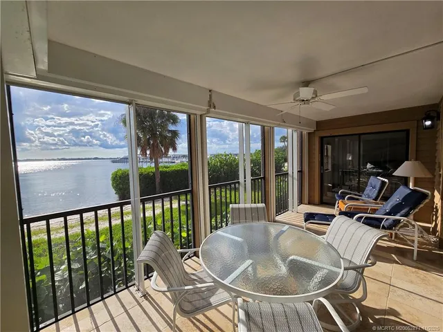 a view of a living room and floor to ceiling window