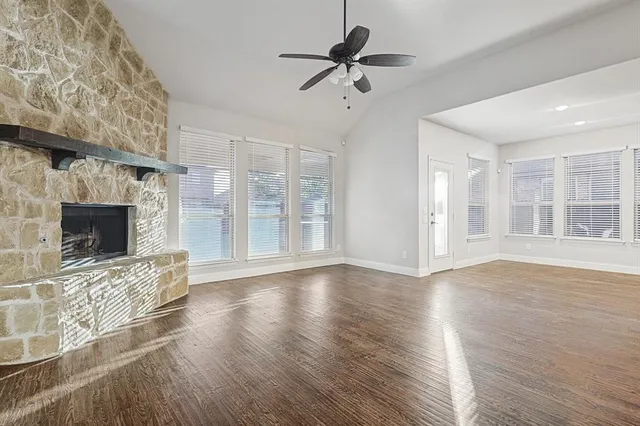 a view of an entryway with wooden floor and a livingroom