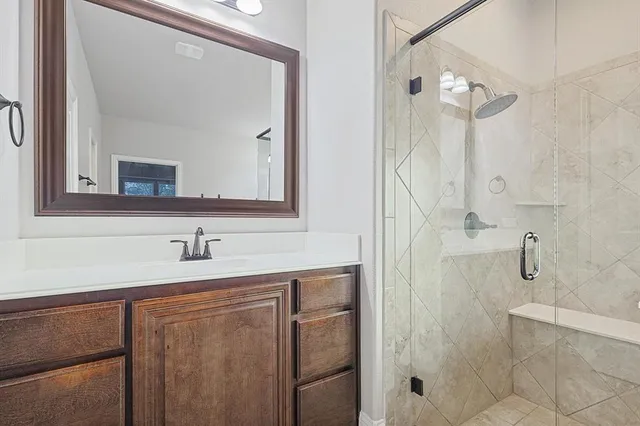 a bathroom with a tub sink and mirror