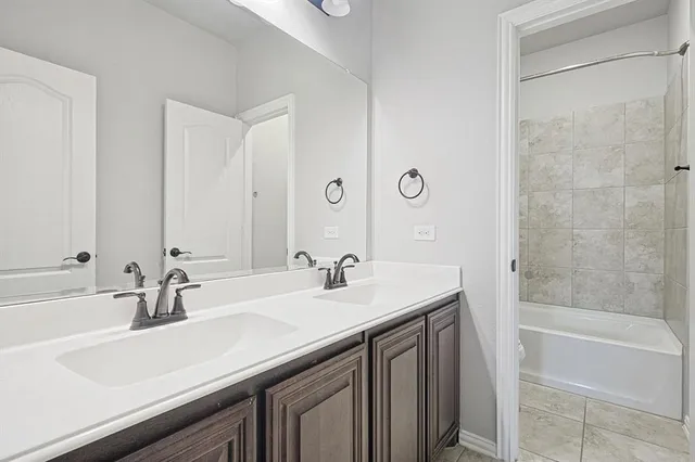 an empty room with a chandelier fan