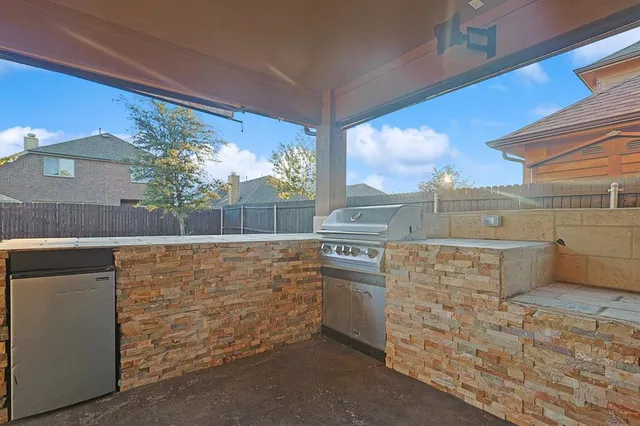 an aerial view of a house with a garden