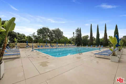 a view of swimming pool from a balcony