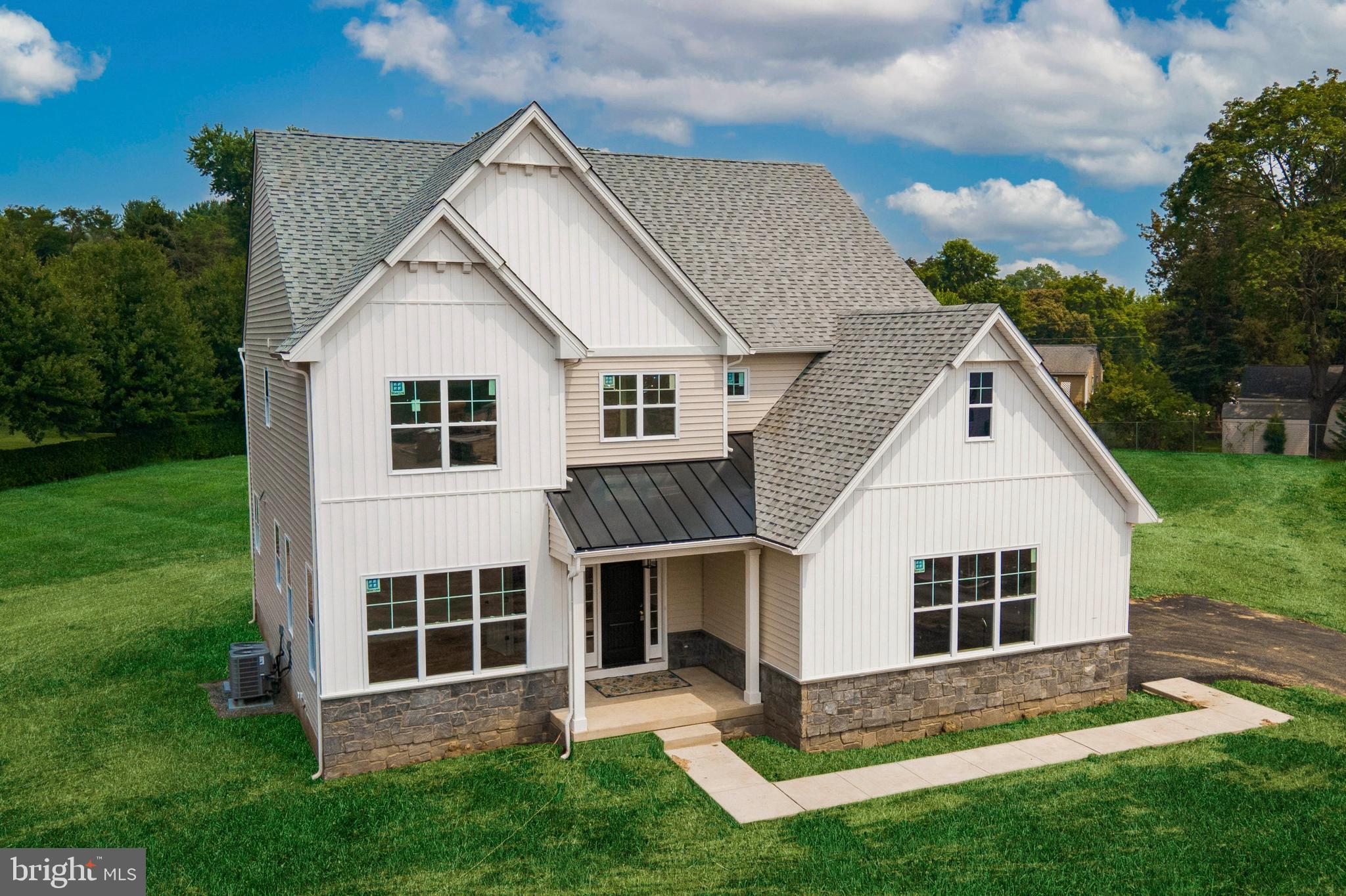 314 Brimfield Road Eagleville, PA 19403 - Photo 1 of 16 a front view of a house with a yard and porch