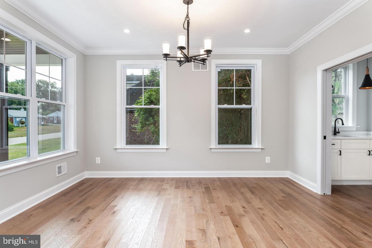 314 Brimfield Road Eagleville, PA 19403 - Photo 11 of 16 a view of an empty room with wooden floor and a window