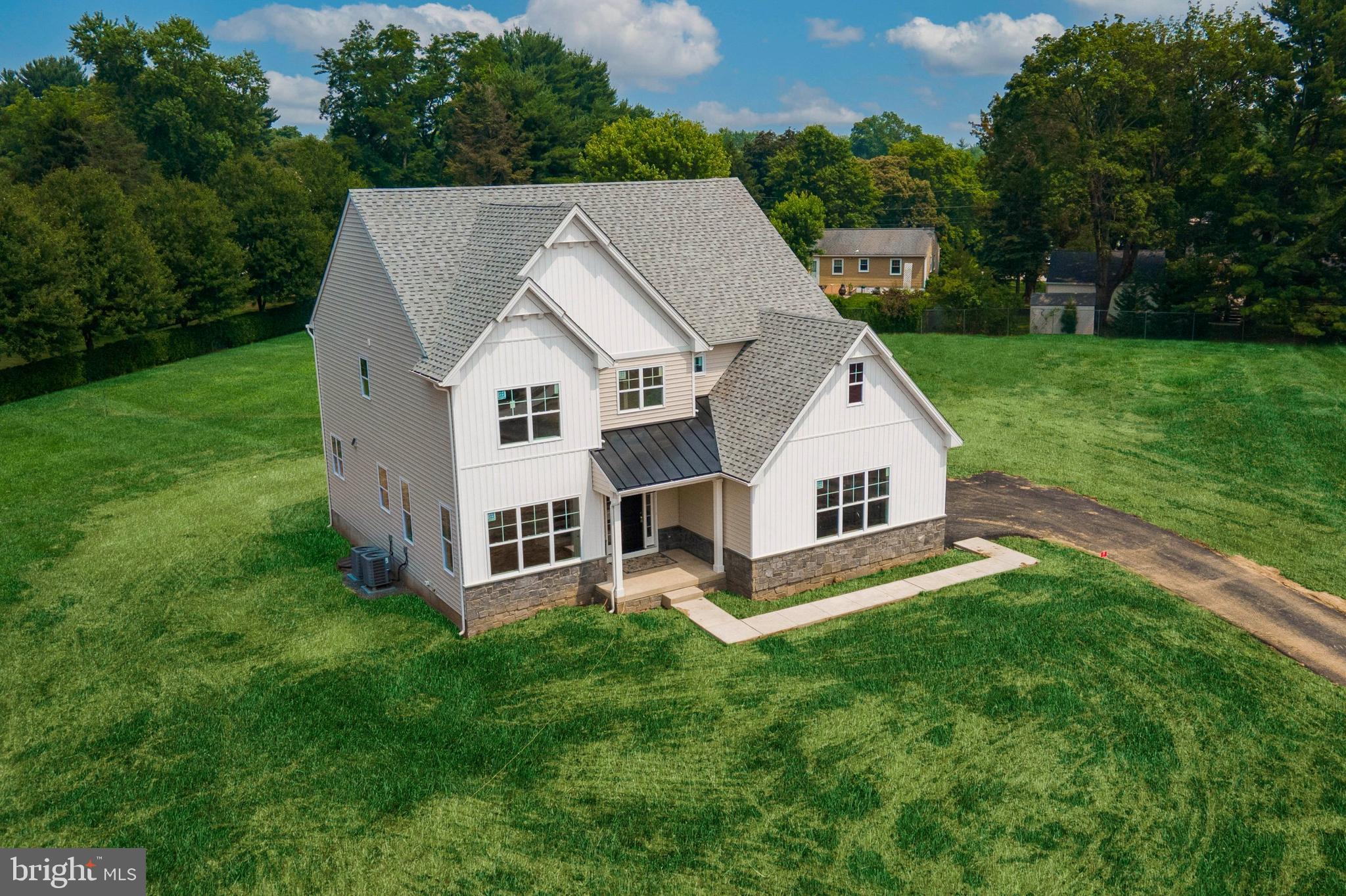 314 Brimfield Road Eagleville, PA 19403 - Photo 15 of 16 a view of a house with backyard and garden