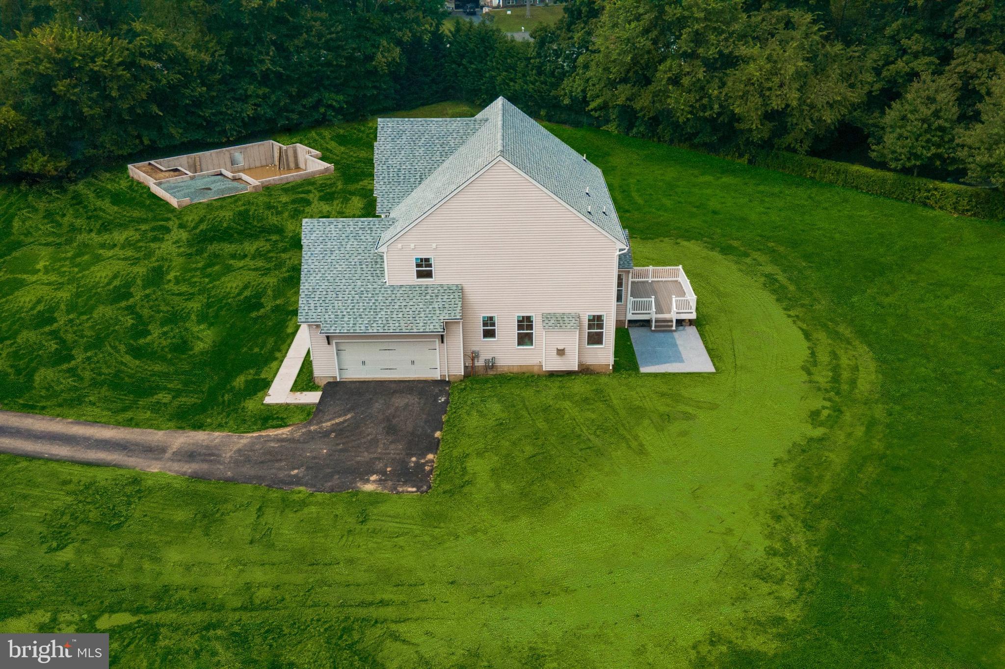 314 Brimfield Road Eagleville, PA 19403 - Photo 16 of 16 a view of a house with a yard deck and a small cabin