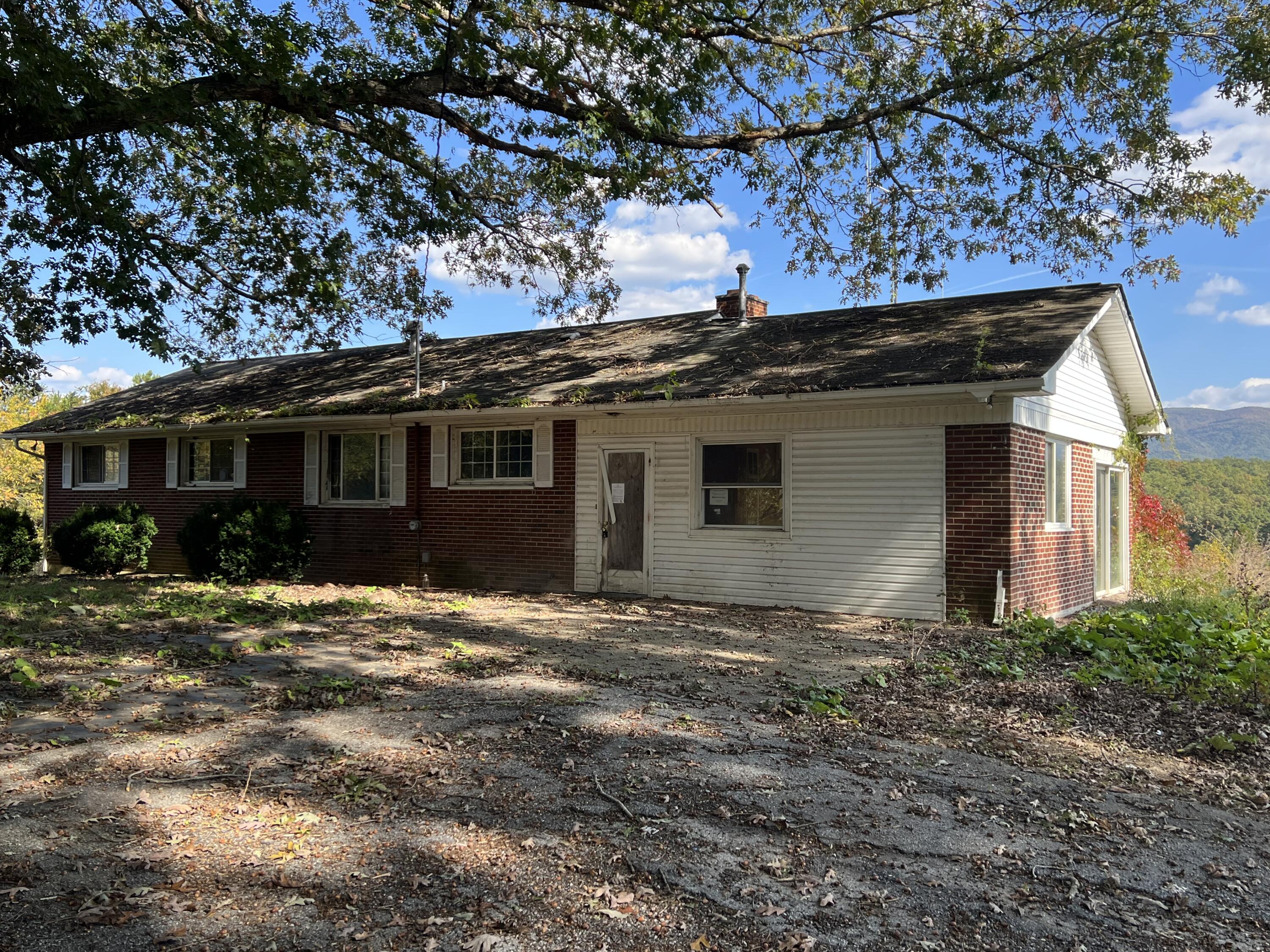 18547 Botetourt Road Eagle Rock, VA 24085 - Photo 3 of 17 a front view of a house with a garden