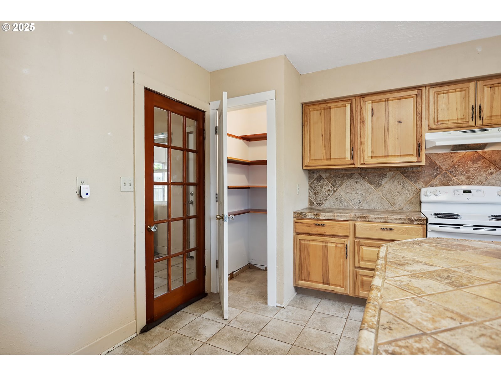 323 West Broadway Street Goldendale, WA 98620 - Photo 13 of 41 a kitchen with stainless steel appliances granite countertop a refrigerator and cabinets
