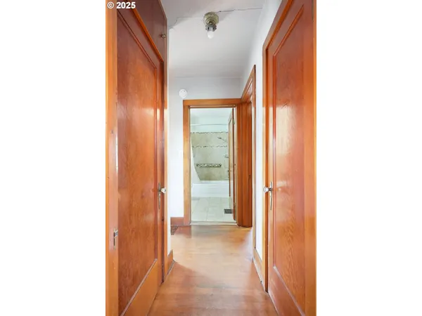 a view of a bathroom with a sink and a mirror