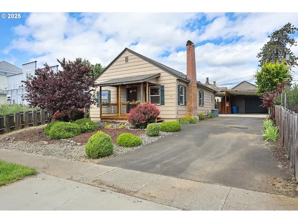 a front view of a house with garden