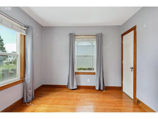 a view of an empty room and window