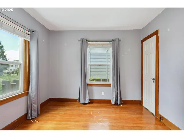 a view of an empty room and window