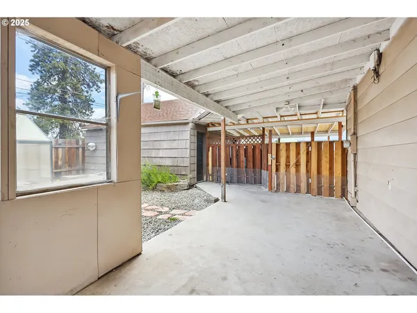 a view of a chairs and table in the patio