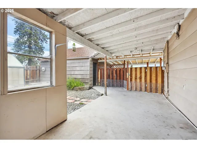 a view of a chairs and table in the patio