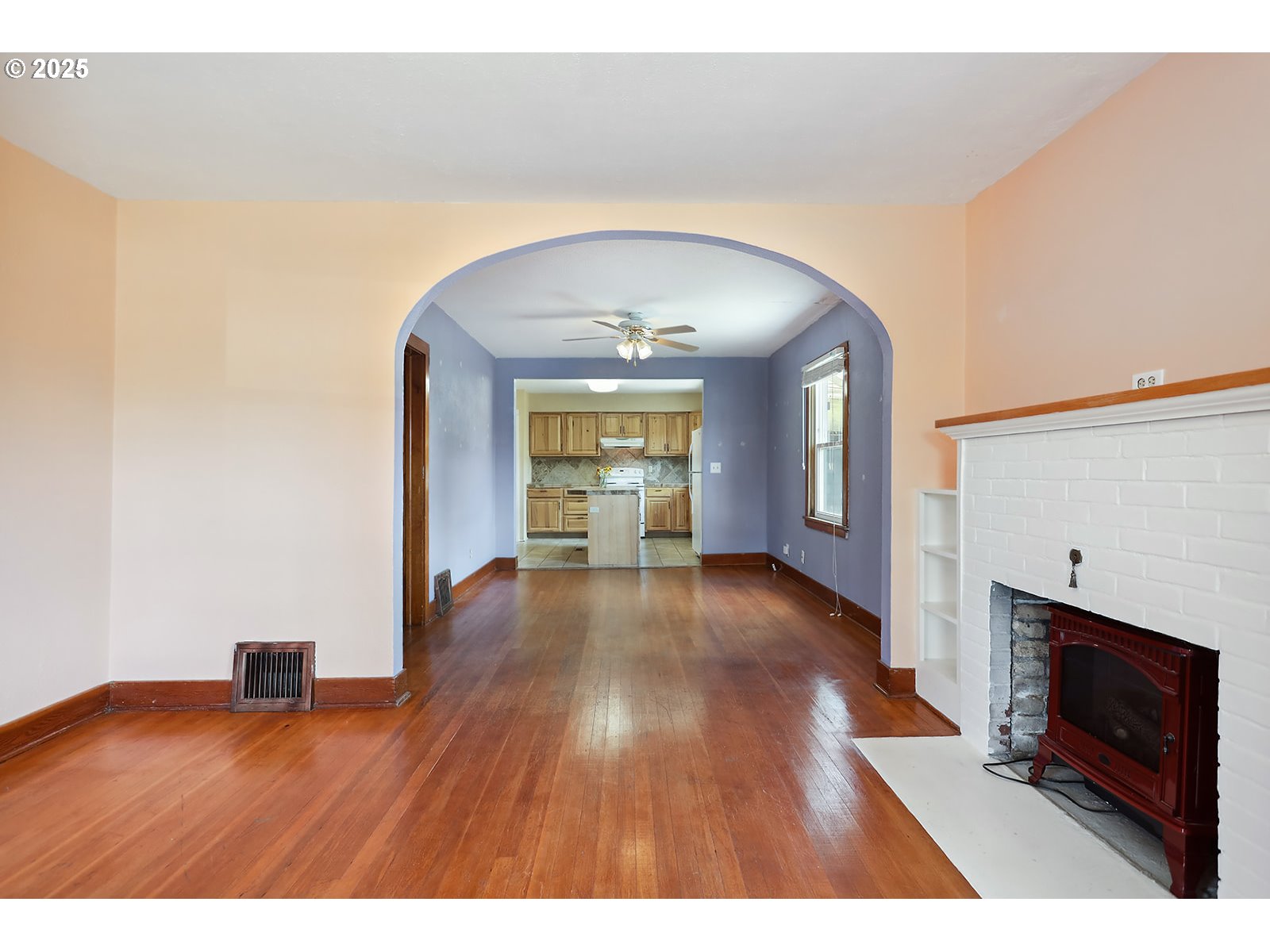 323 West Broadway Street Goldendale, WA 98620 - Photo 3 of 41 a view interior of a house wooden floor and fire place