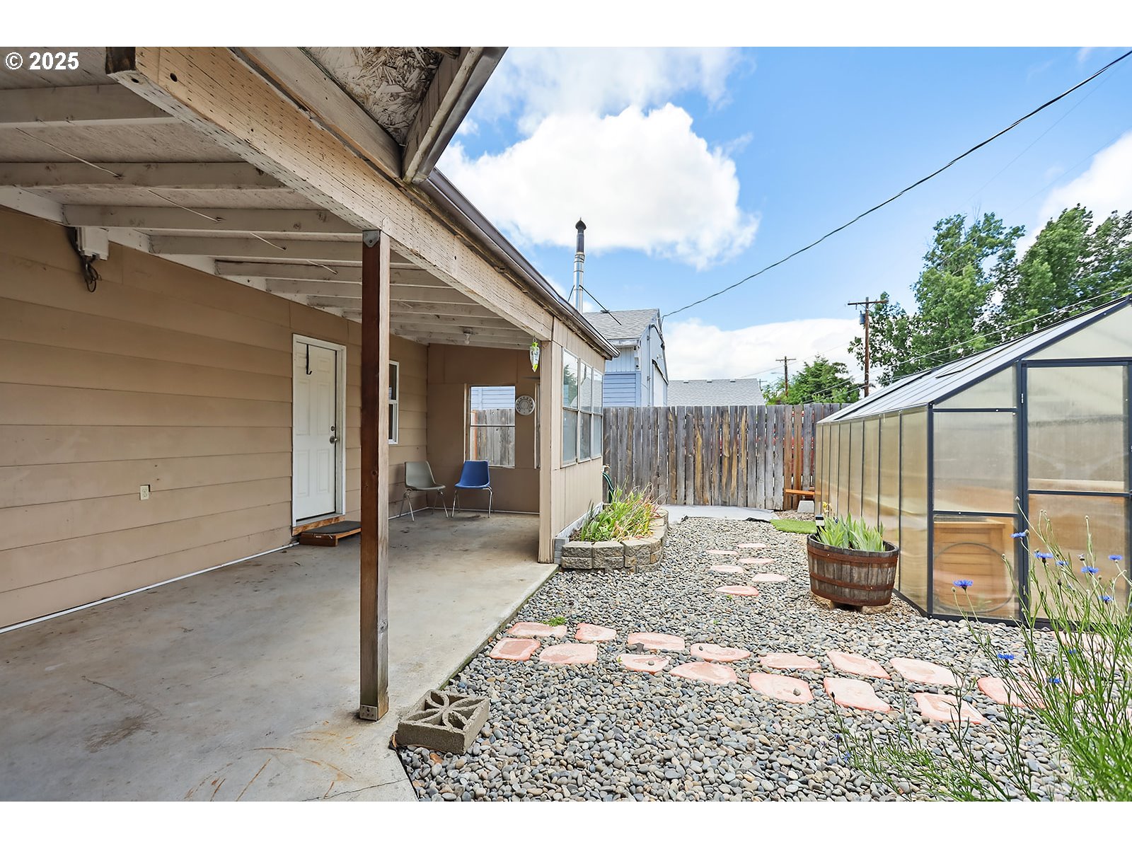 323 West Broadway Street Goldendale, WA 98620 - Photo 32 of 41 a backyard of a house with table and chairs