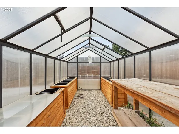 a backyard of a house with potted plants