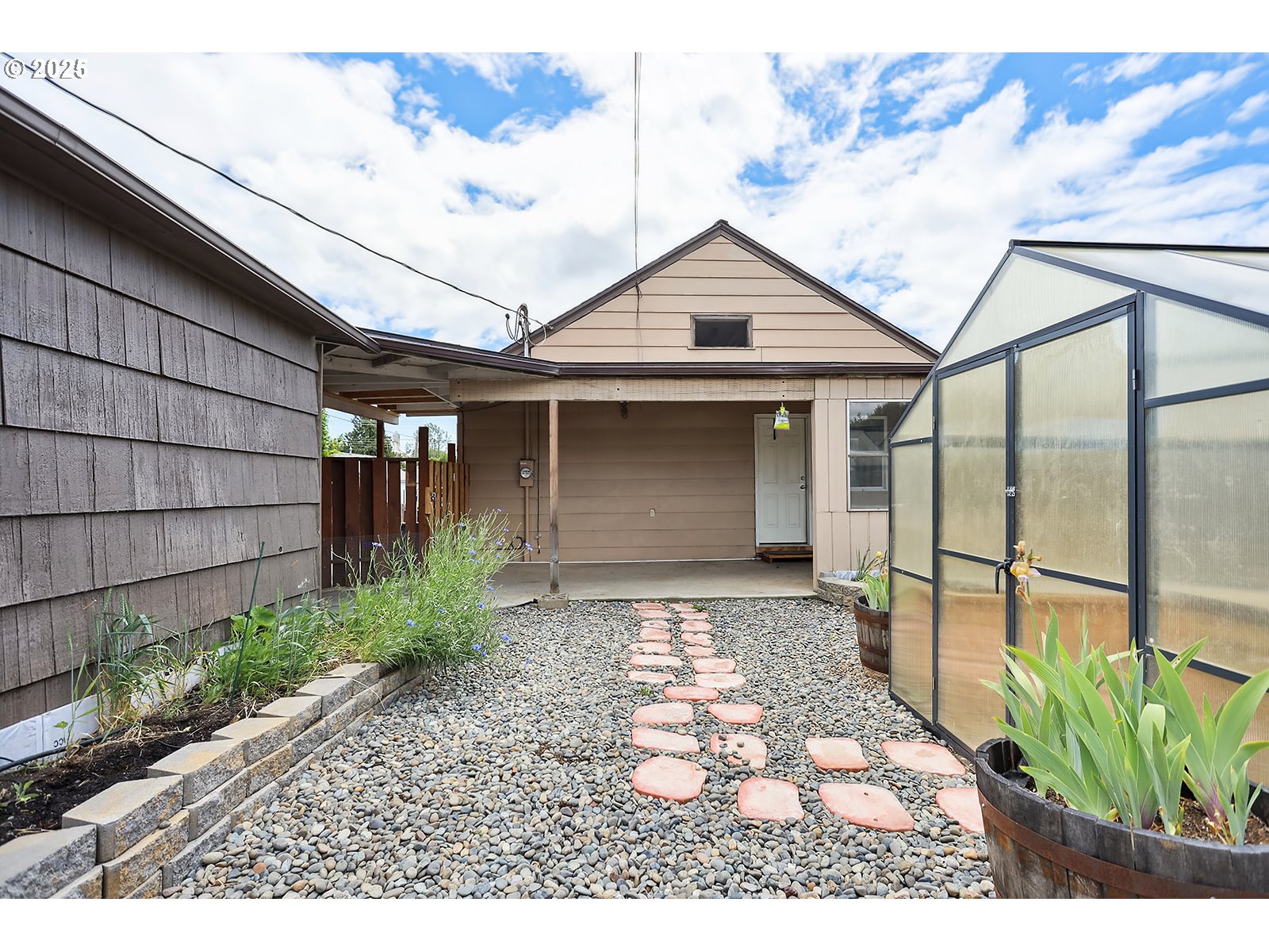 323 West Broadway Street Goldendale, WA 98620 - Photo 36 of 41 a backyard of a house with potted plants