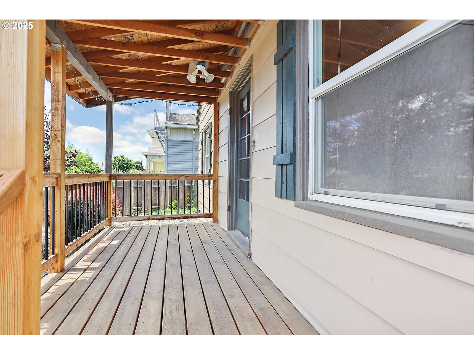 323 West Broadway Street Goldendale, WA 98620 - Photo 37 of 41 a view of backyard with a large window and wooden floor