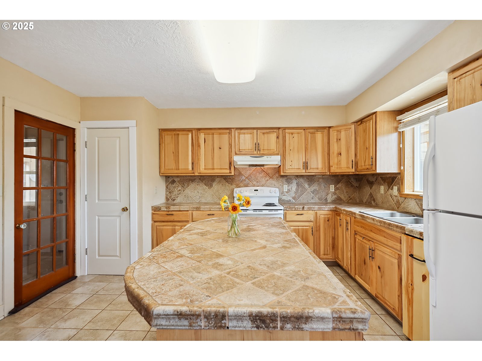 323 West Broadway Street Goldendale, WA 98620 - Photo 9 of 41 a kitchen with stainless steel appliances granite countertop a refrigerator sink and cabinets