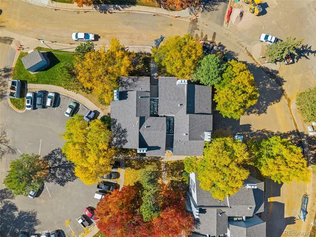 an aerial view of residential houses with outdoor space