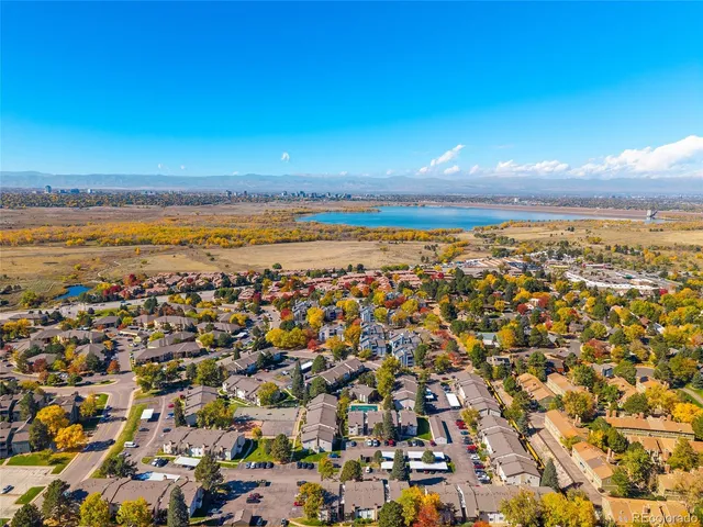an aerial view of residential building and ocean