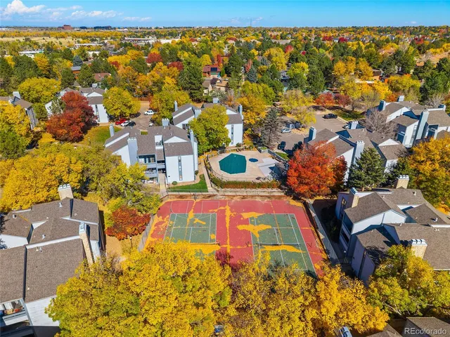 an aerial view of residential houses with swimming pool