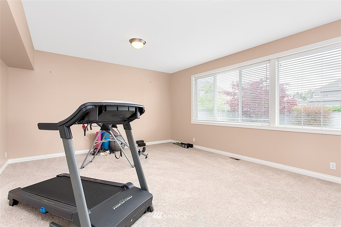 258 Lyons Place Northeast Renton, WA 98059 - Photo 15 of 25 a view of a room with gym equipment