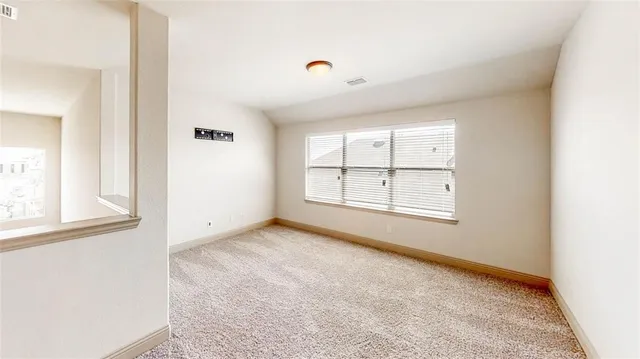 a bathroom with a tub and a mirror