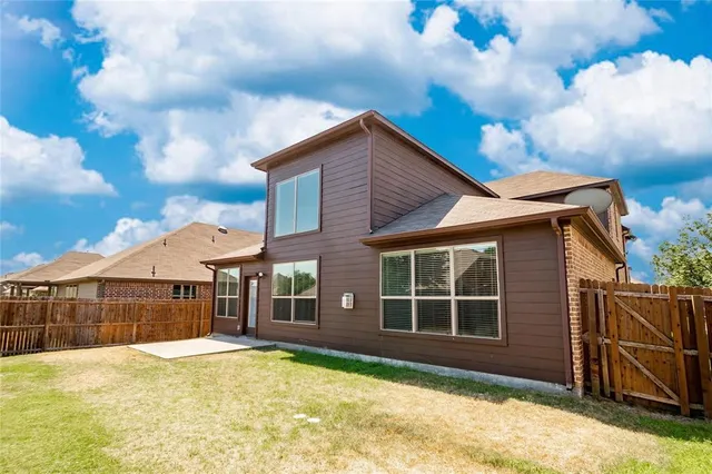 a view of hallway with stairs and a wooden floor