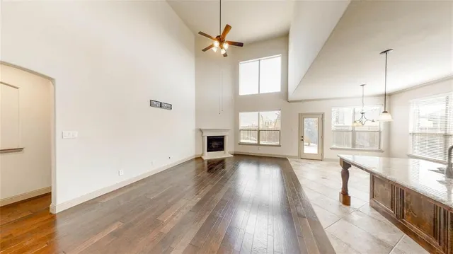 a view of a kitchen with a sink and wooden floor