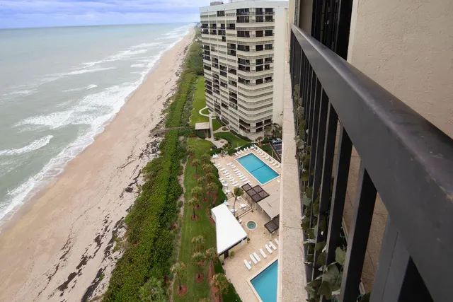 an aerial view of houses with yard