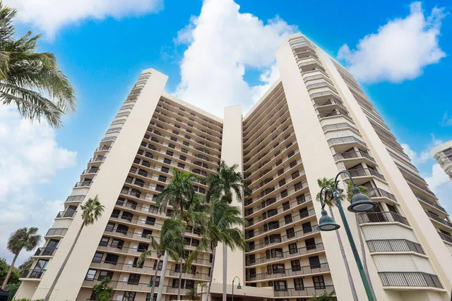 a view of building with yard and seating space
