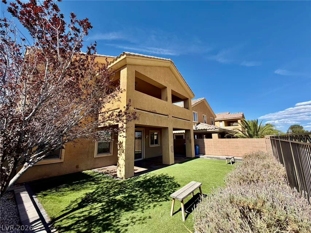 135 Tall Ruff Drive Las Vegas, NV 89148 - Photo 26 of 29 A private yard with artificial turf offers an inviting outdoor retreat.