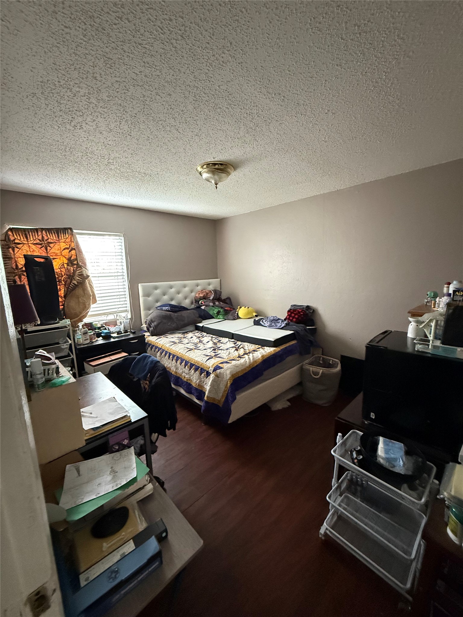 11905 Alpheus Avenue Austin, TX 78759 - Photo 13 of 23 a bedroom with furniture and a window