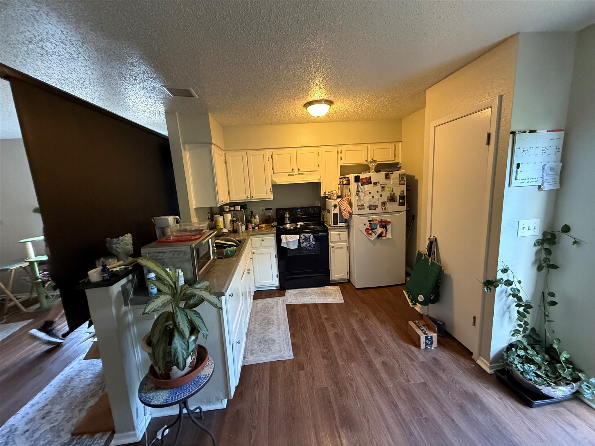 11905 Alpheus Avenue Austin, TX 78759 - Photo 14 of 23 a view of a workspace with furniture and wooden floor