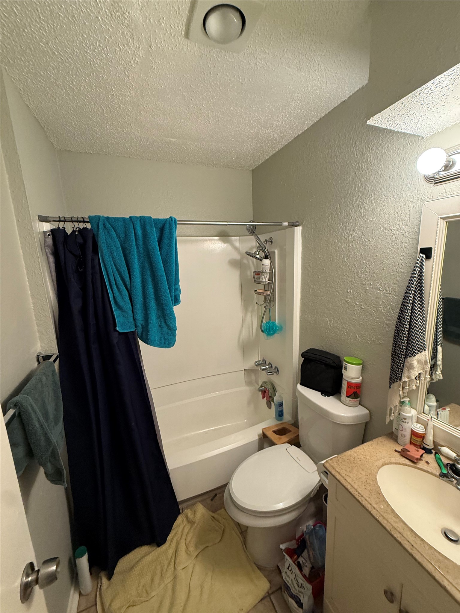 11905 Alpheus Avenue Austin, TX 78759 - Photo 18 of 23 a bathroom with a sink toilet and shower