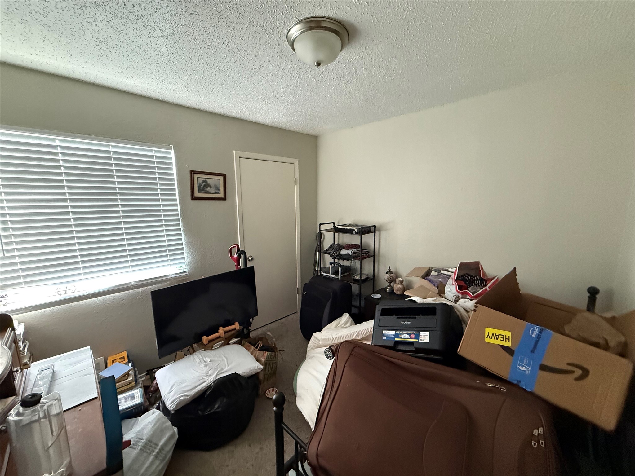 11905 Alpheus Avenue Austin, TX 78759 - Photo 19 of 23 a bedroom with furniture and a window