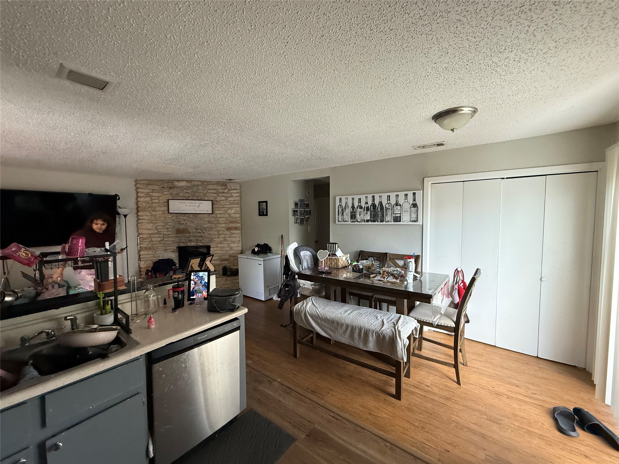 11905 Alpheus Avenue Austin, TX 78759 - Photo 20 of 23 a living room with furniture a wooden floor and a sink