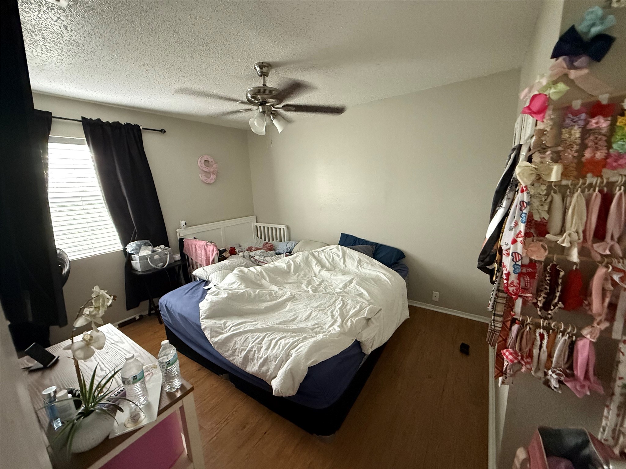 11905 Alpheus Avenue Austin, TX 78759 - Photo 21 of 23 a bed sitting in a bedroom next to a window